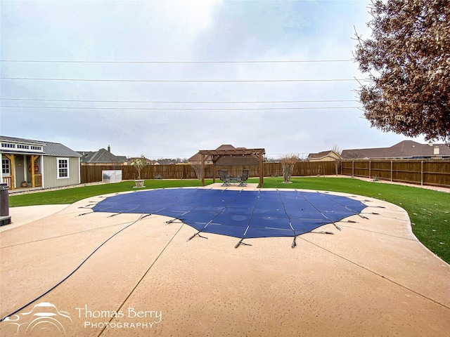 view of pool featuring a fenced in pool, a gazebo, a patio area, a fenced backyard, and an outdoor structure