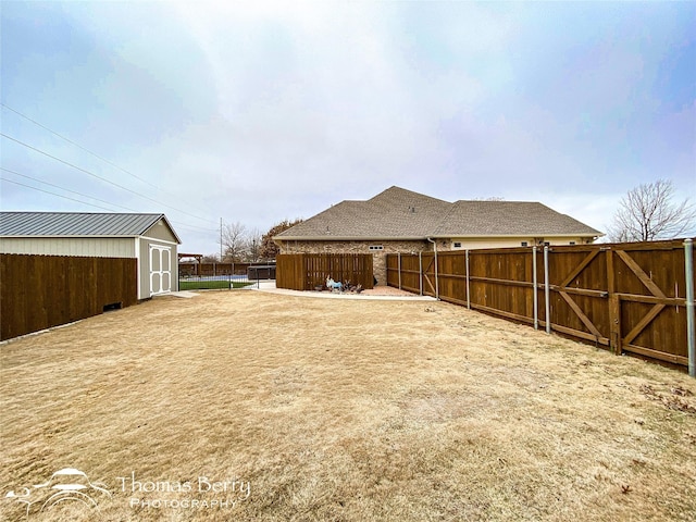 view of yard with a gate and fence