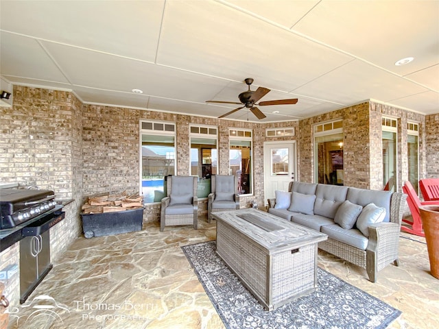 view of patio / terrace featuring ceiling fan and an outdoor living space