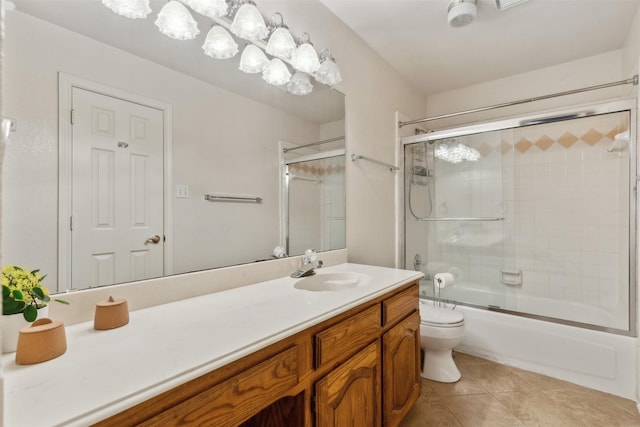 full bathroom featuring enclosed tub / shower combo, tile patterned flooring, toilet, and vanity