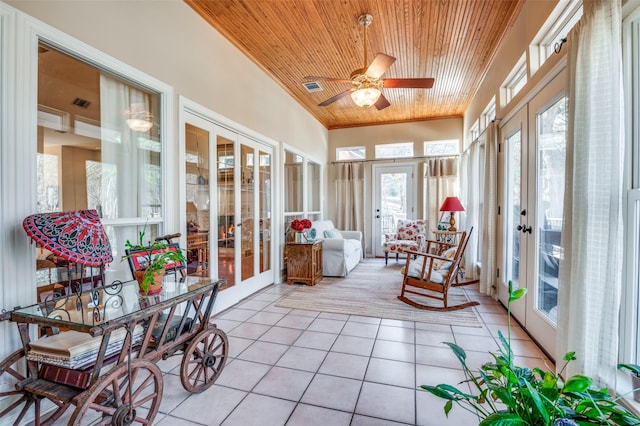 sunroom / solarium with ceiling fan, wood ceiling, french doors, and visible vents