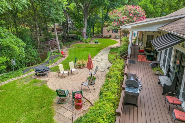 view of yard with a patio and a wooden deck