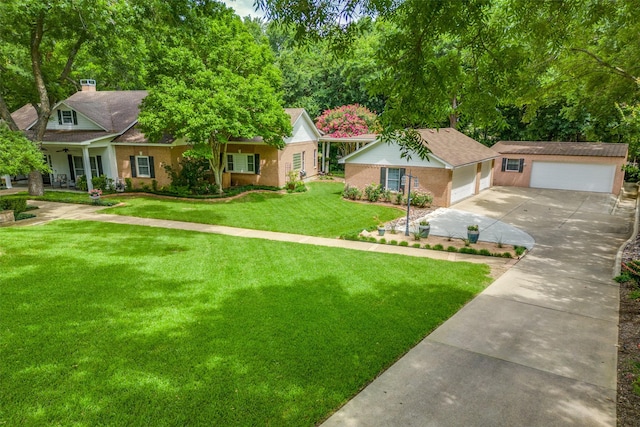 view of front facade with driveway, a garage, a front lawn, and brick siding