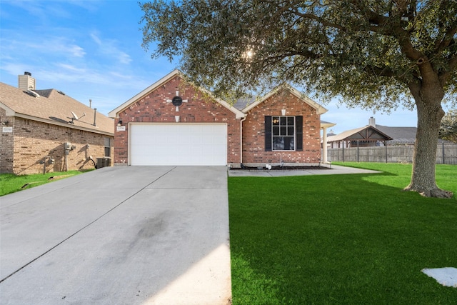 view of front of house featuring a front lawn and a garage