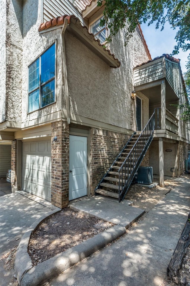 6046 Stoneybrook Dr, Fort Worth, TX 76112 - exterior space with central AC unit and a garage