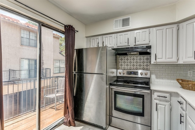 6046 Stoneybrook Dr, Fort Worth, TX 76112 - kitchen with appliances with stainless steel finishes, backsplash, light tile patterned flooring, white cabinets, and range hood