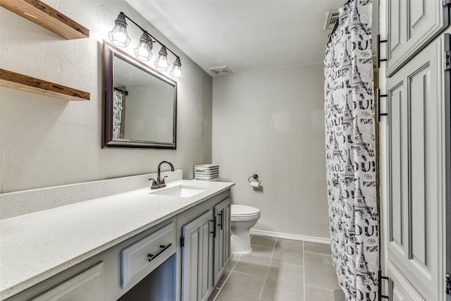 6046 Stoneybrook Dr, Fort Worth, TX 76112 - bathroom featuring toilet, vanity, and tile patterned flooring