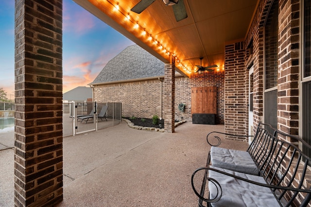 view of patio featuring ceiling fan