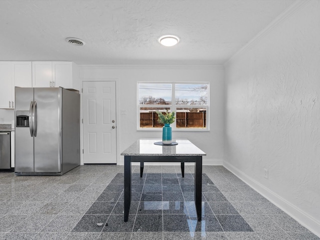 unfurnished office with ornamental molding and a textured ceiling