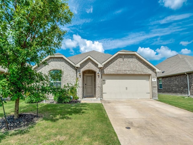 view of front of property featuring a garage, a front yard, brick siding, and concrete driveway