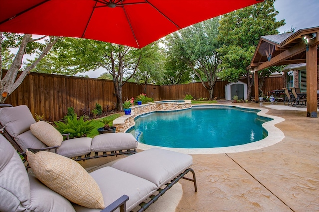 view of pool featuring a fenced in pool, a storage unit, an outbuilding, a patio, and a fenced backyard