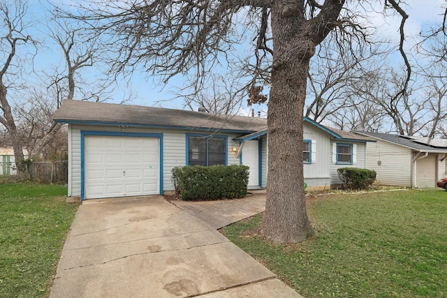 ranch-style house featuring a garage, fence, driveway, and a front lawn