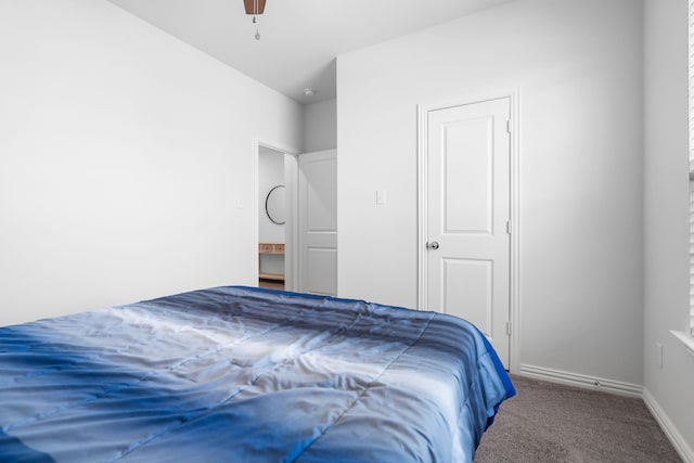 carpeted bedroom with baseboards and ceiling fan