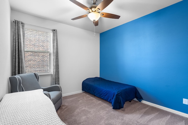 bedroom with baseboards, ceiling fan, and carpet