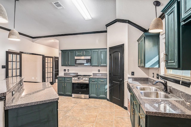 kitchen with a sink, decorative light fixtures, stainless steel appliances, and visible vents