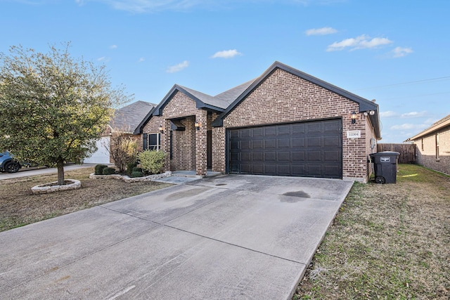 ranch-style house with brick siding, fence, driveway, and a garage