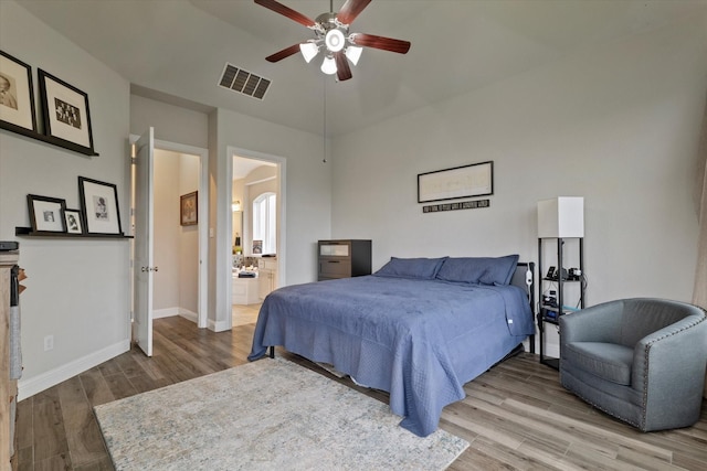 4109 Chantilly Ln, Frisco, TX 75036 - bedroom with wood finished floors, baseboards, connected bathroom, and a ceiling fan