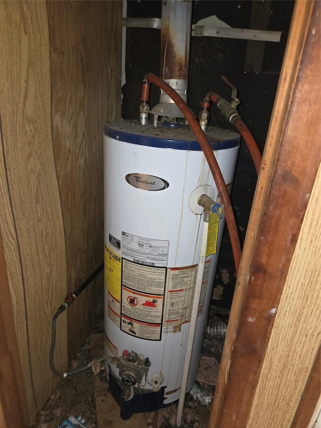 utility room featuring water heater