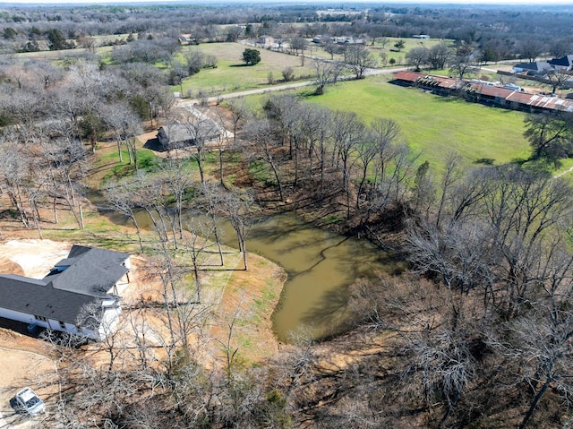 aerial view with a rural view and a water view