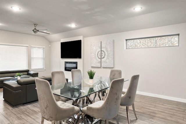 dining area featuring wood finished floors, baseboards, recessed lighting, lofted ceiling, and ceiling fan