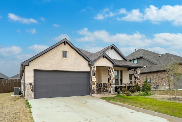 view of front of property with cooling unit, a front lawn, a porch, board and batten siding, and concrete driveway