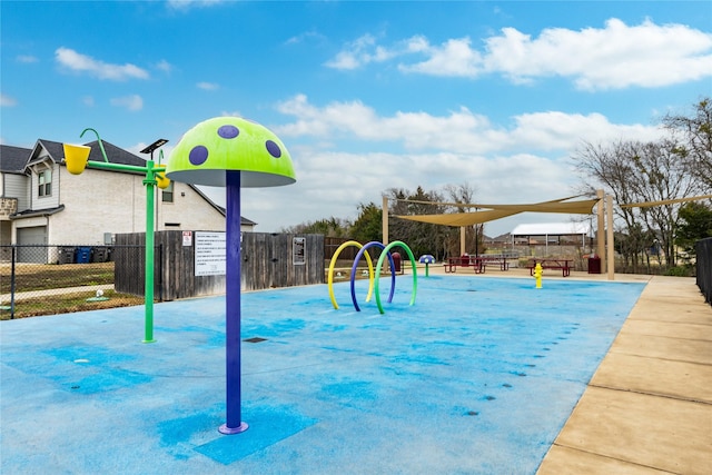 view of jungle gym featuring fence