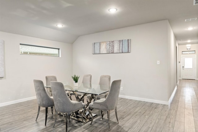 dining space featuring visible vents, baseboards, and light wood-type flooring