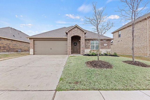 ranch-style home featuring a front yard, brick siding, and driveway