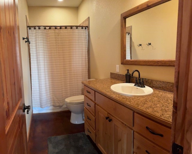 full bath with vanity, toilet, and shower / bath combo with shower curtain
