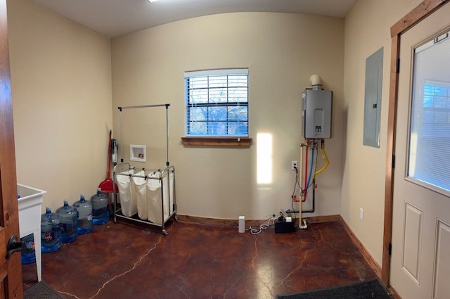 interior space with tankless water heater, baseboards, washer hookup, electric panel, and laundry area