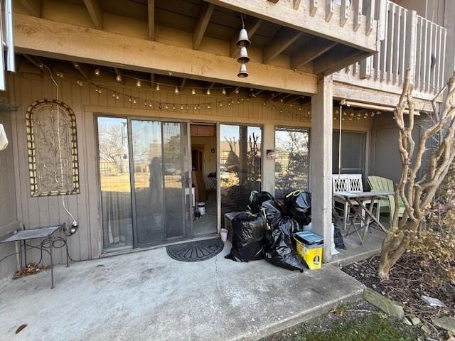 doorway to property with a patio