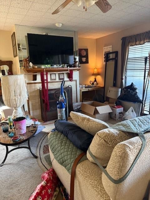 living room with carpet flooring and a ceiling fan