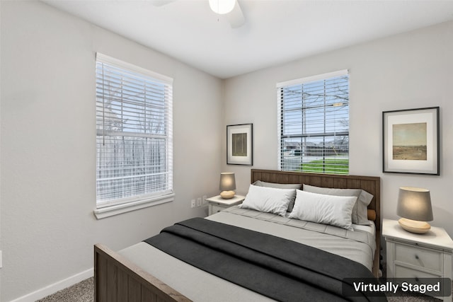 bedroom with baseboards, ceiling fan, and carpet floors