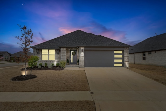 3002 Northshore Dr, Celina, TX 75009 - view of front facade with brick siding, a shingled roof, a garage, and driveway