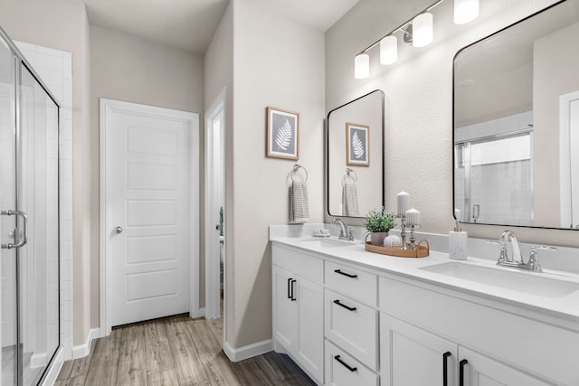 3002 Northshore Dr, Celina, TX 75009 - full bathroom with a shower stall, double vanity, and wood finished floors