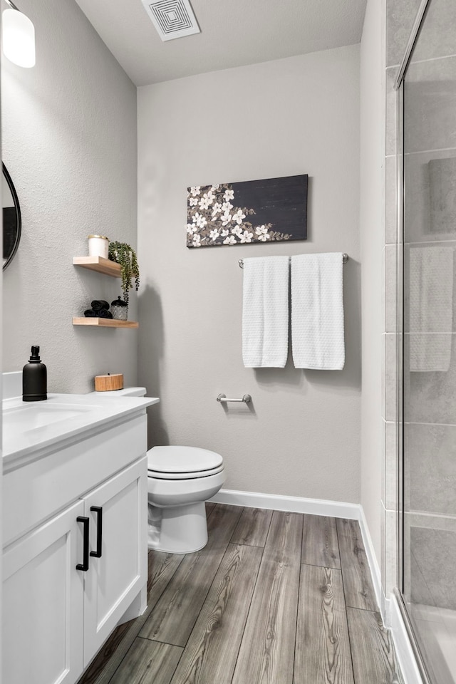 3002 Northshore Dr, Celina, TX 75009 - full bath featuring vanity, wood finished floors, and a tile shower