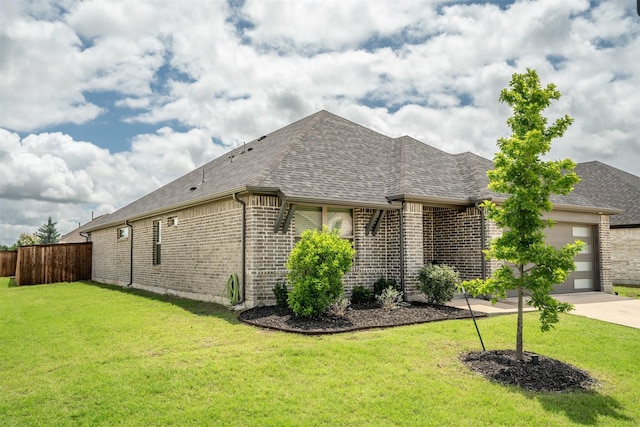 3002 Northshore Dr, Celina, TX 75009 - view of side of property with an attached garage, brick siding, a shingled roof, and concrete driveway