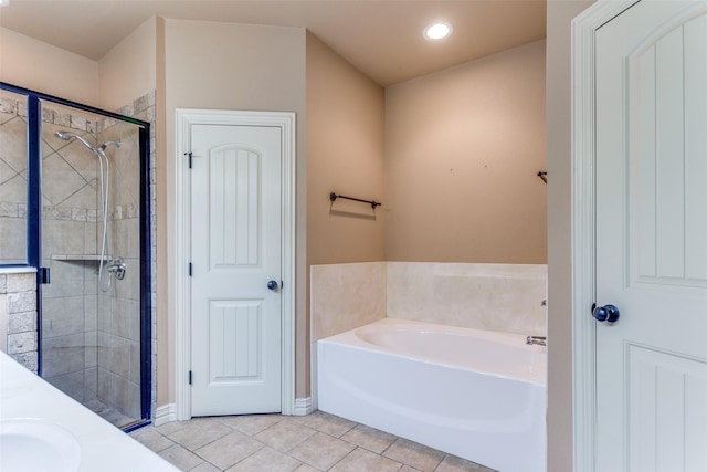 bathroom with recessed lighting, tile patterned floors, a stall shower, a sink, and a bath