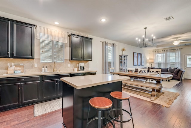124 Feverbush Dr, Fate, TX 75189 - kitchen with a sink, plenty of natural light, wood finished floors, and recessed lighting