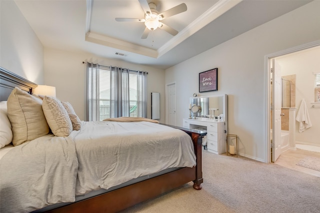 124 Feverbush Dr, Fate, TX 75189 - bedroom with a tray ceiling, light colored carpet, crown molding, ensuite bathroom, and baseboards
