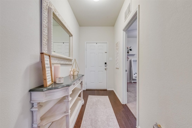 124 Feverbush Dr, Fate, TX 75189 - entryway featuring dark wood finished floors and a textured wall