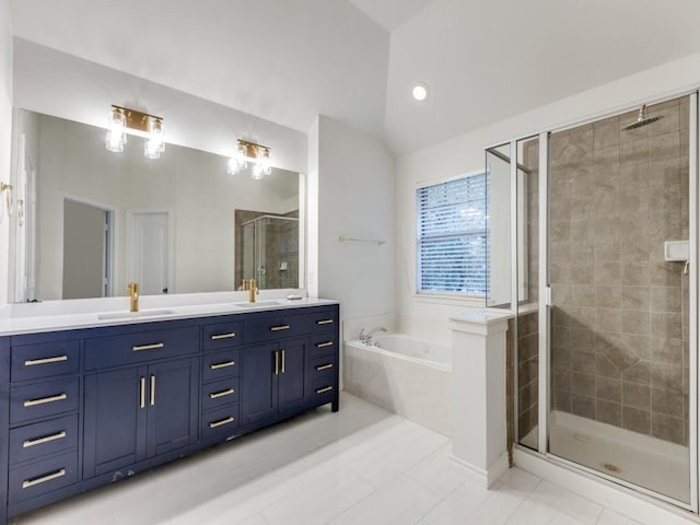 bathroom with lofted ceiling, a shower stall, double vanity, and a sink