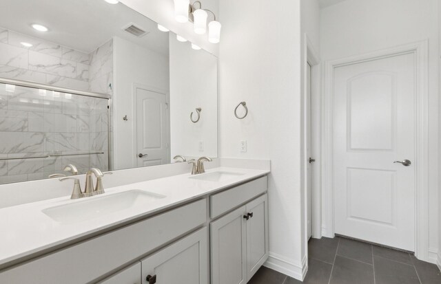 5917 Mayer Ave, Pilot Point, TX 75009 - full bath with a stall shower, double vanity, tile patterned flooring, baseboards, and recessed lighting