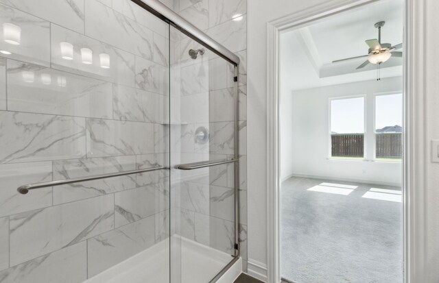 5917 Mayer Ave, Pilot Point, TX 75009 - bathroom featuring a stall shower, a ceiling fan, and baseboards