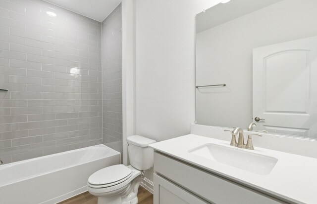 5917 Mayer Ave, Pilot Point, TX 75009 - bathroom featuring wood finished floors, toilet, vanity, and shower / bath combination