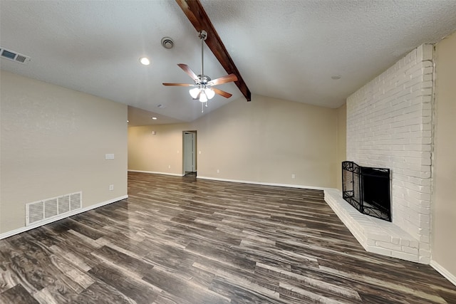 unfurnished living room featuring vaulted ceiling with beams, a brick fireplace, visible vents, and dark wood-type flooring