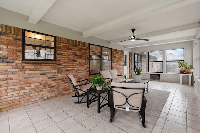 sunroom / solarium featuring beam ceiling, visible vents, and a ceiling fan