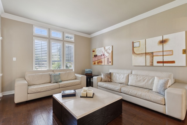 living room featuring dark wood-type flooring, crown molding, and baseboards