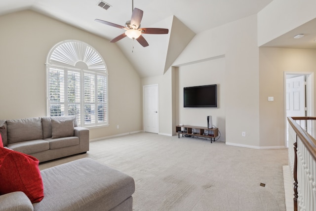 living room with baseboards, a ceiling fan, visible vents, and light carpet