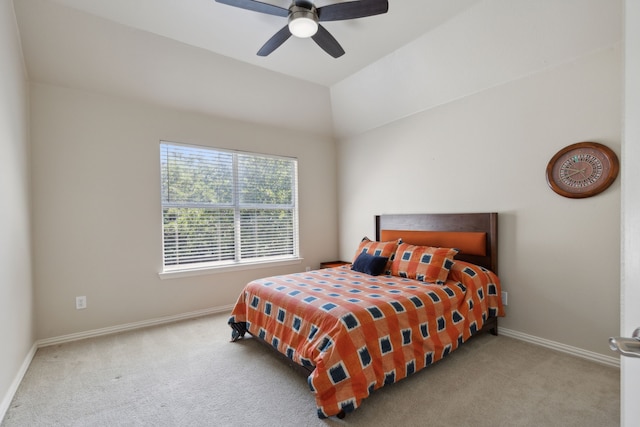 carpeted bedroom with baseboards, lofted ceiling, and a ceiling fan